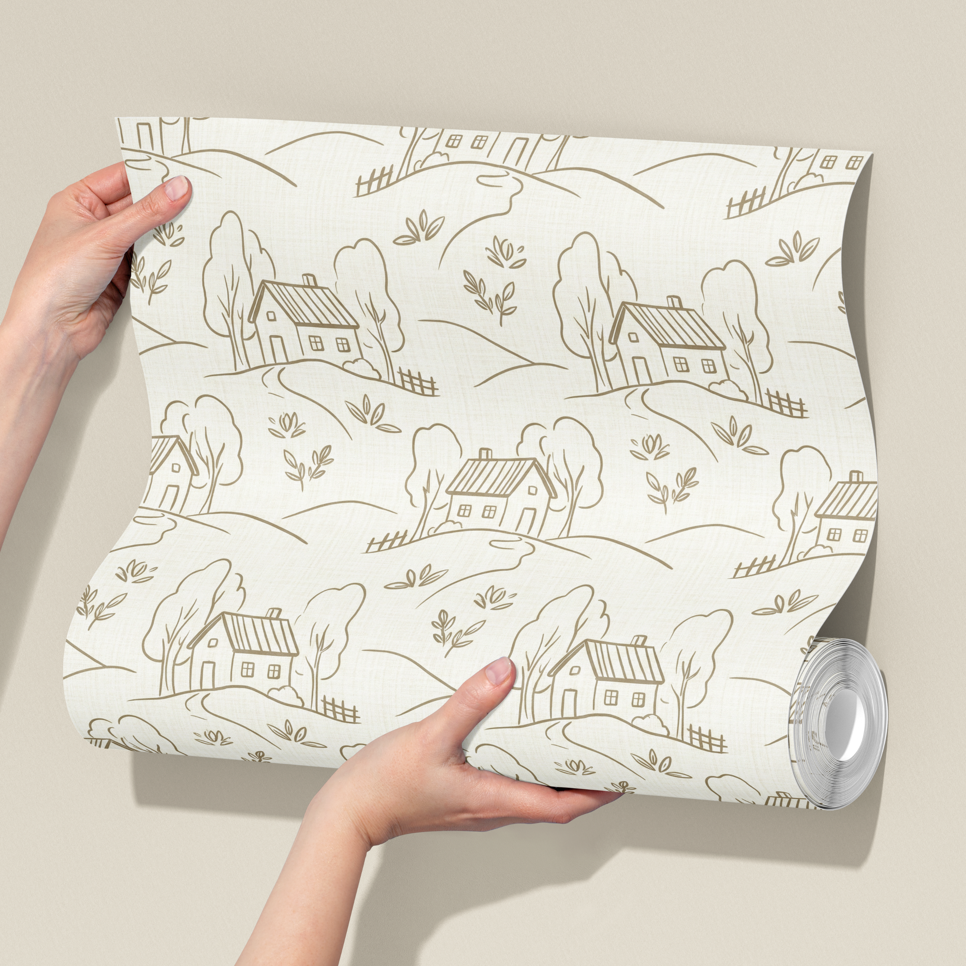 Person holding a roll of wallpaper with a landscape design on a beige background
