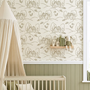 Children's room with crib, decorative shelf, and patterned wallpaper featuring houses and trees.