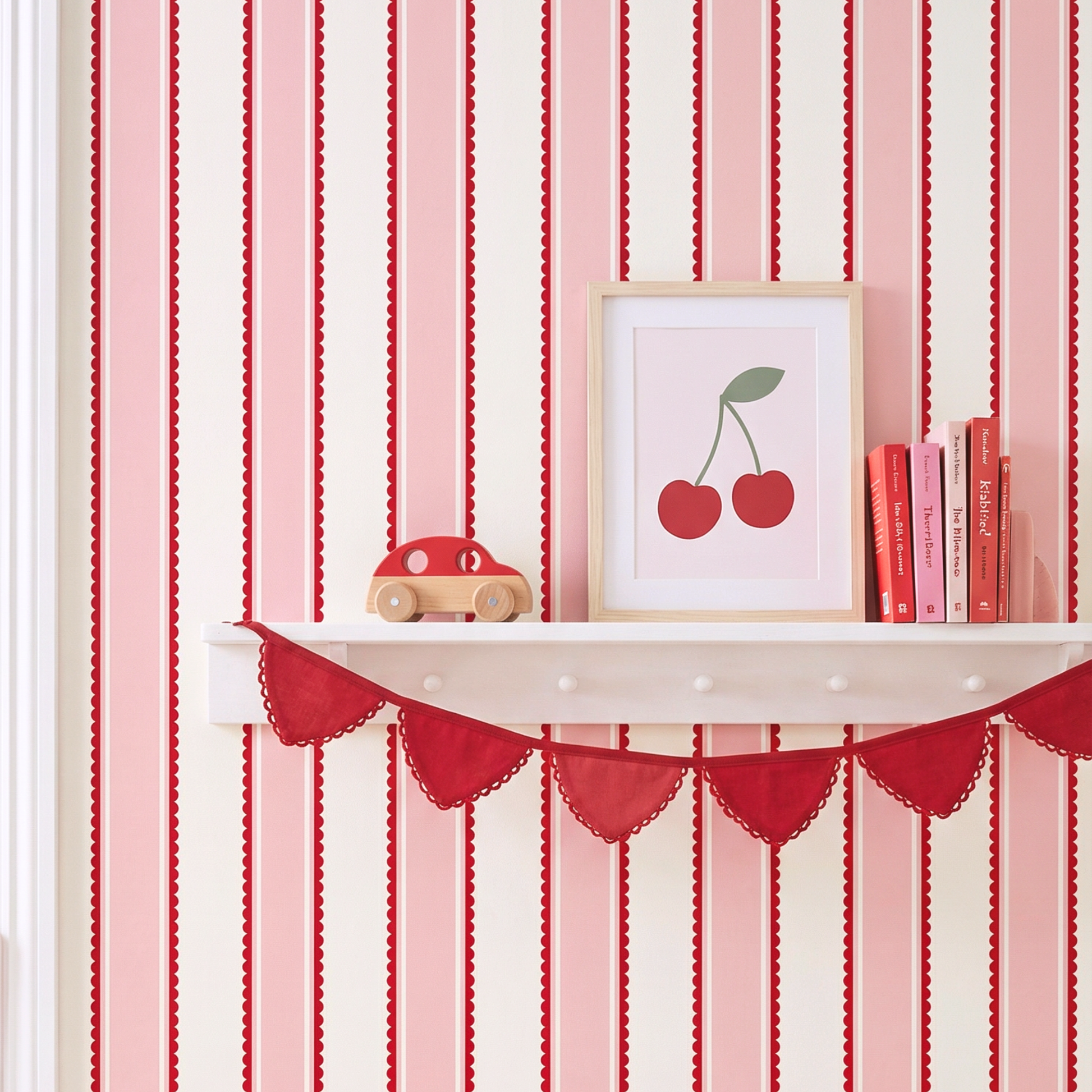 Scalloped stripe wallpaper with red bunting and shelf decor, pink striped kids room wallpaper styling