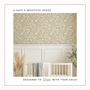 Nursery room with floral wallpaper, crib, and decorative elements.