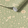 Close up of sage green woodland wallpaper roll with mushrooms and floral pattern, neutral nursery wall design