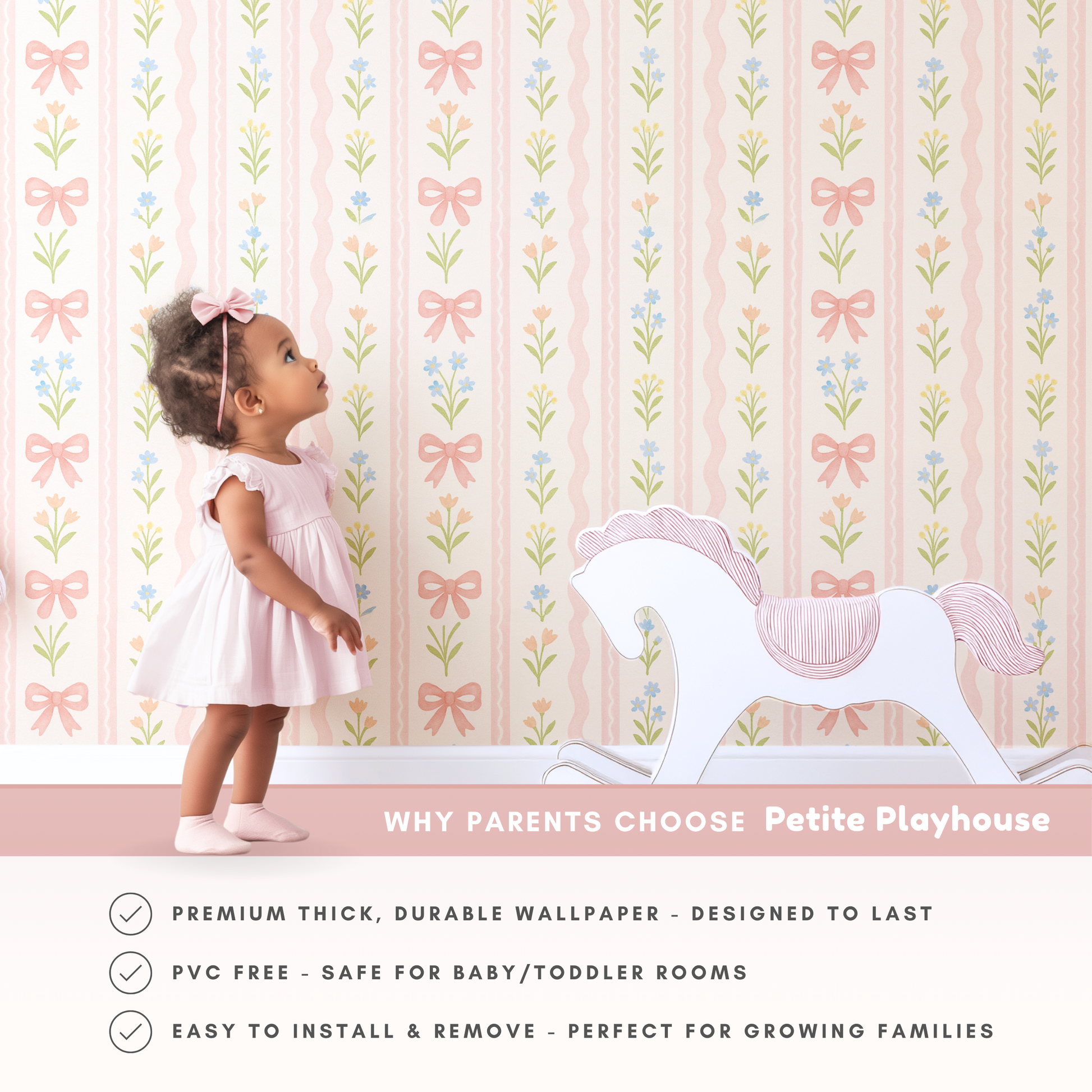 Toddler girl in pink dress standing against bow floral wallpaper, pastel nursery wall decor with rocking horse, soft baby girl room