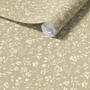 Roll of floral wallpaper with a beige background