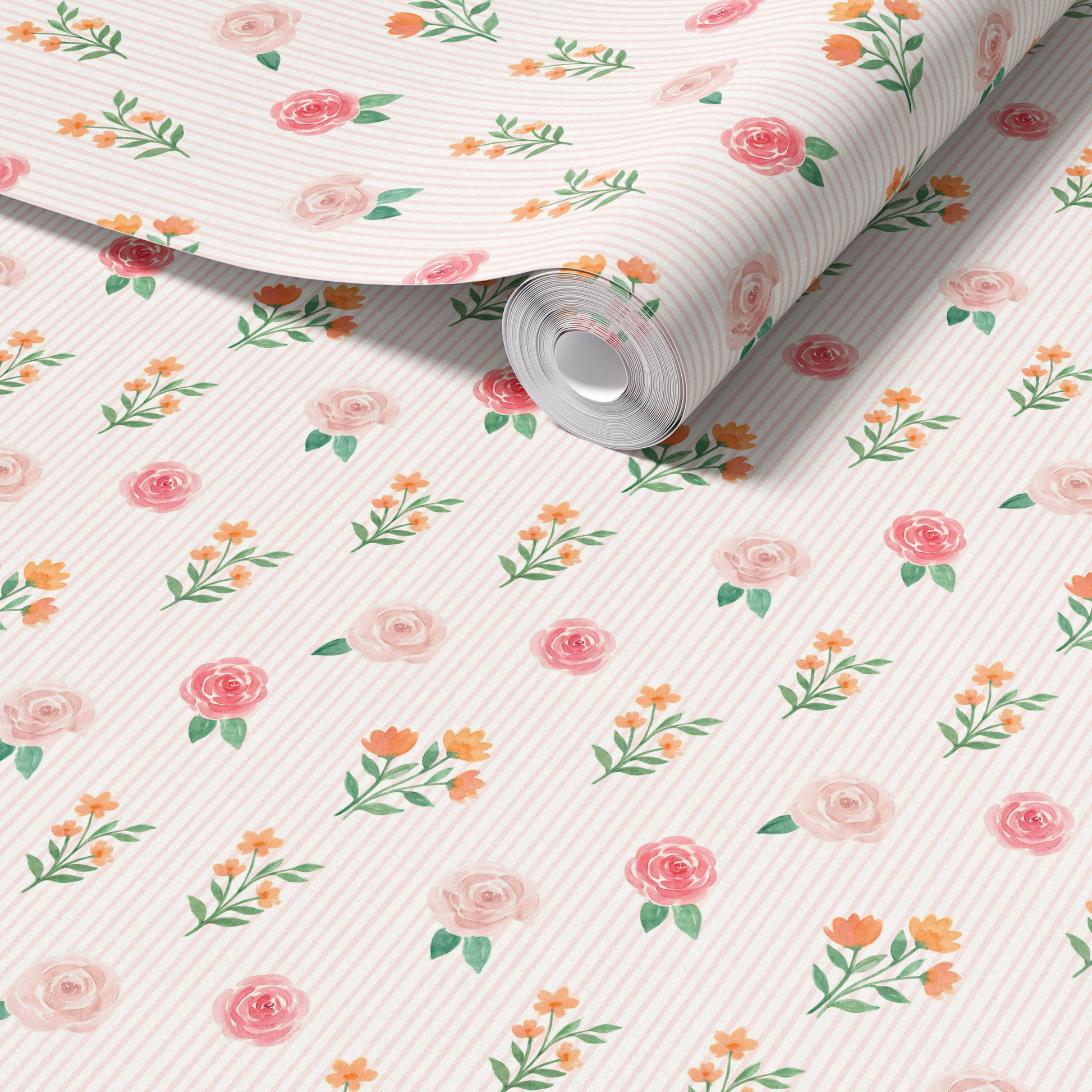 Close up of blush pink floral stripe wallpaper roll showing delicate roses wildflowers and soft vertical stripes