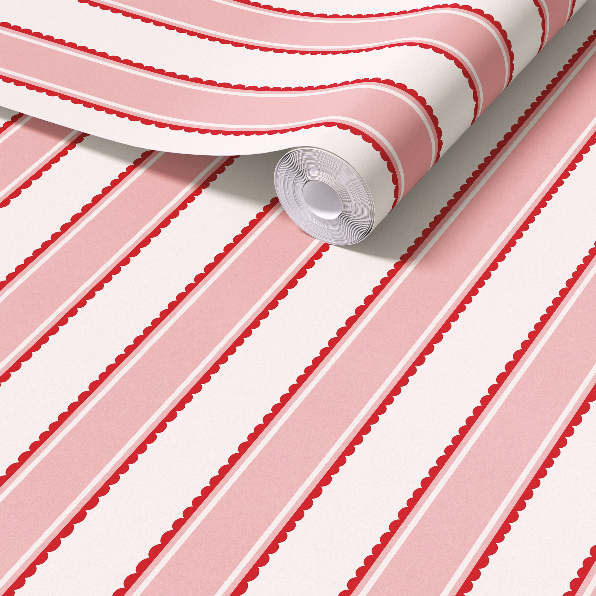 Scalloped stripe wallpaper behind kids play kitchen and chair, red pink striped nursery wall design