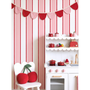 Scalloped stripe wallpaper behind kids play kitchen and chair, red pink striped nursery wall design
