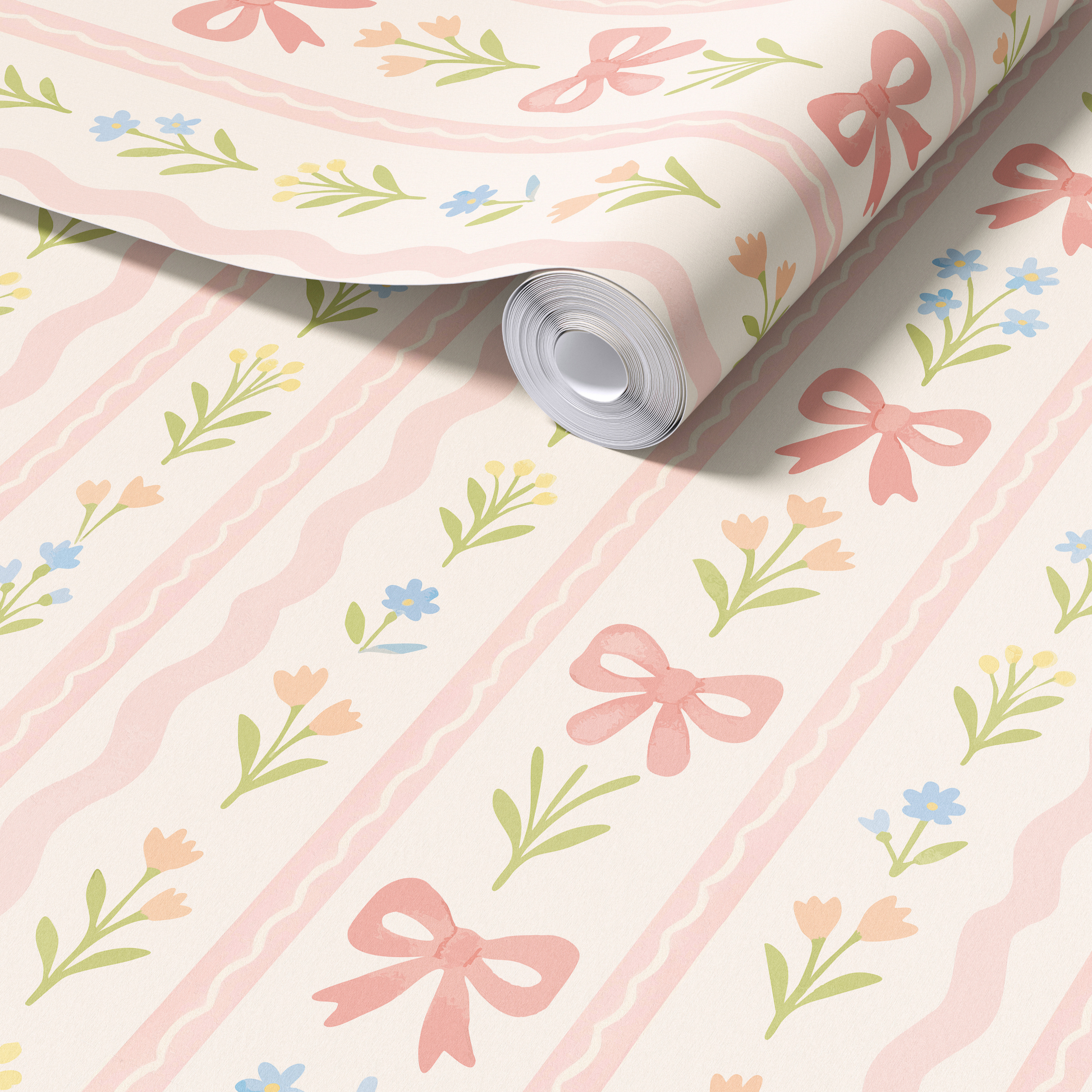 Close up of pink bow floral wallpaper roll showing textured matte finish, pastel stripe nursery wallpaper with flowers and ribbons